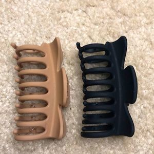 two hair styling claw clips